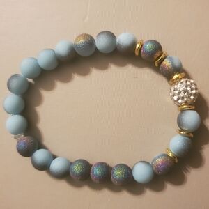 Handmade by my daughter. Elegant Matte Blue and Gold Beaded Bracelet